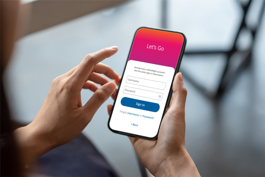 Person holding mobile device with RaiseRight app open