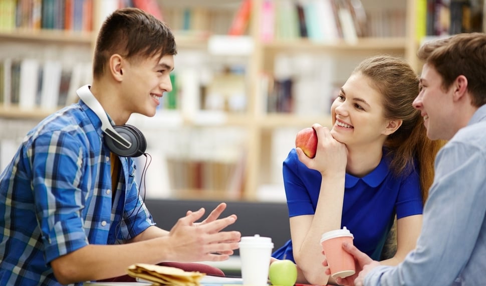 students_chatting_at_a_table
