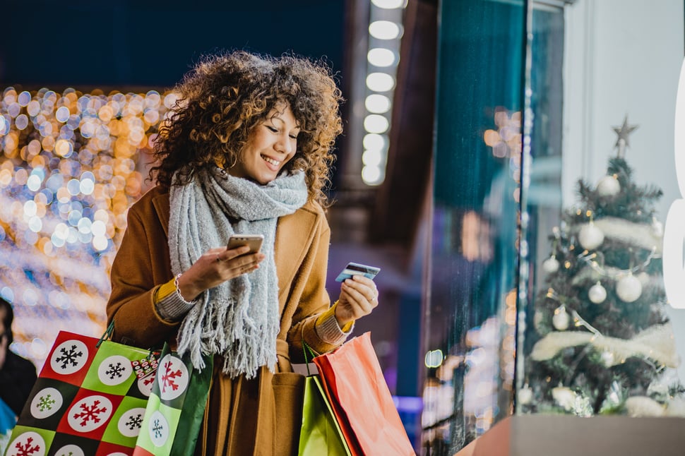 Woman shopping with gift cards