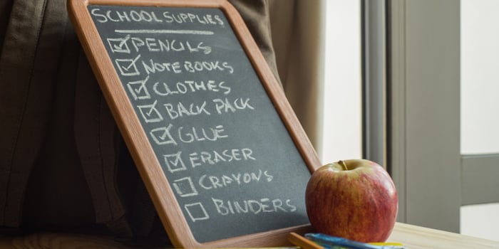 school-supply-list-with-school-supplies-and-an-apple-picture-id467579581