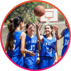 Girls on fundraised basketball team practicing outside