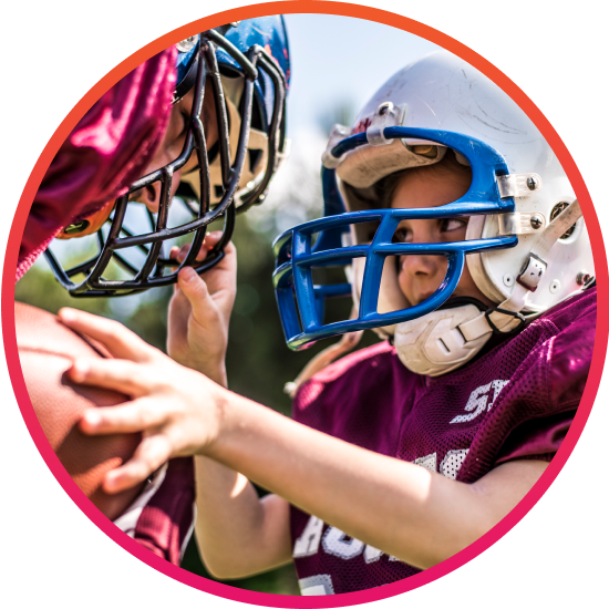 Kid on fundraised football team getting tackled