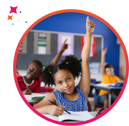 Young girl raising her hand in public school classroom