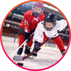 Kids on fundraised hockey team playing keep away with the puck