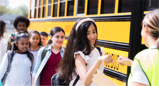 Children getting on the school bus to go to school