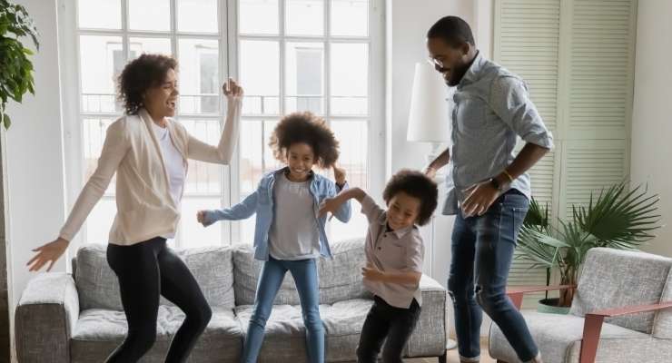 family celebrates the funds they have raised for